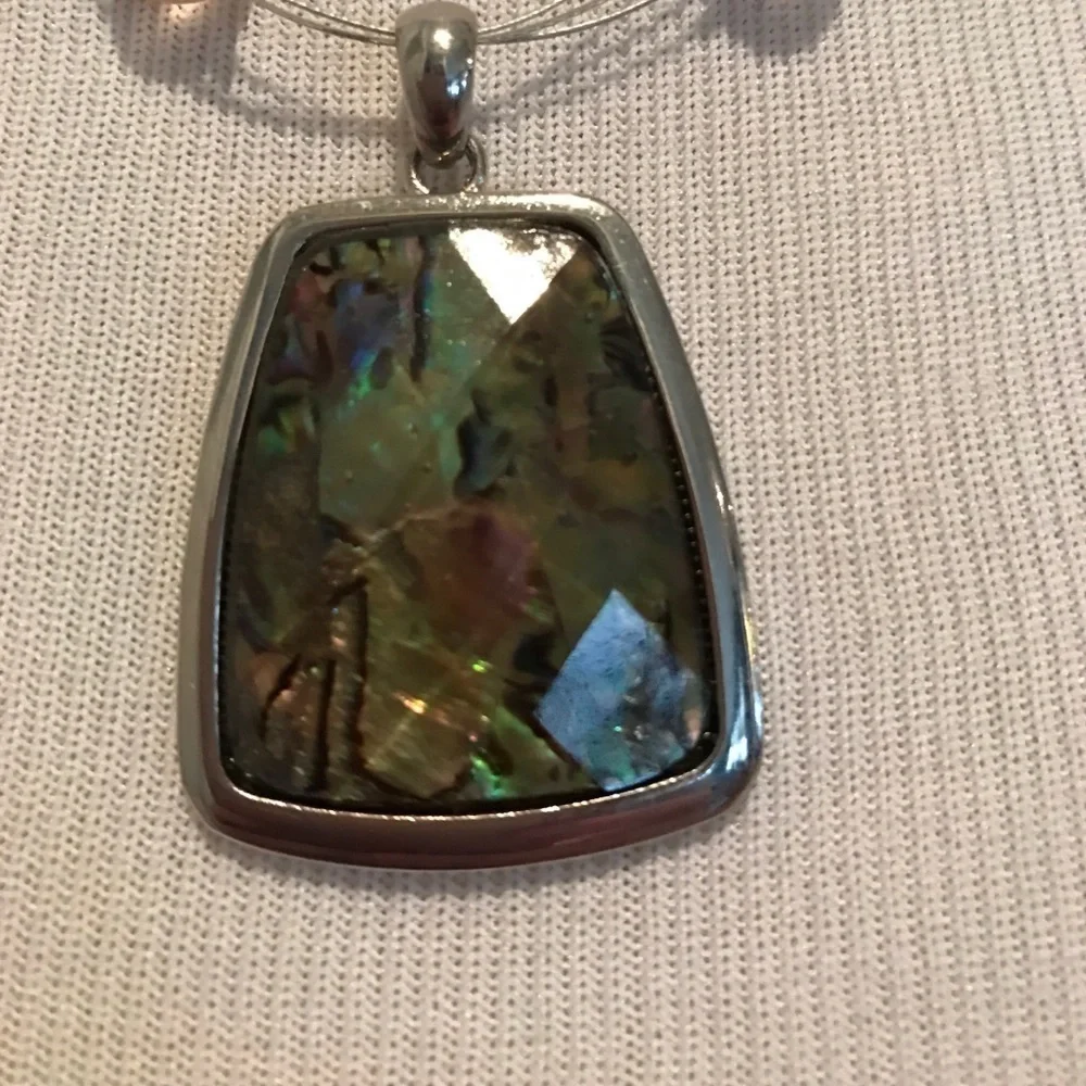 Faceted colorful pendant on triple wire with beads
